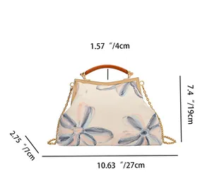 Detailed size chart of floral embroidered handbag with metal chain and top handle dimensions