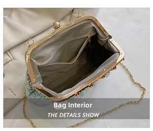 Detail view of the sequined evening bag interior with zipper pocket and chain strap