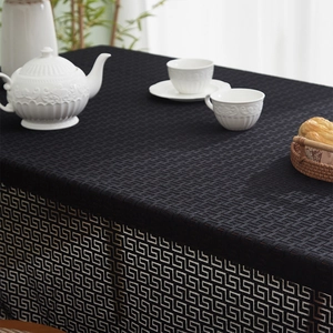 Black linen tablecloth with golden Greek key pattern for rectangular dining tables