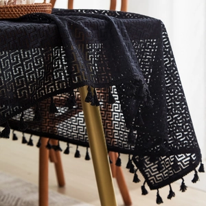 Elegant black hollow lace tablecloth with geometric patterns and fringe tassels decoration