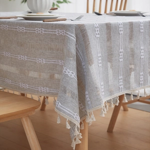 French vintage linen tablecloth with geometric embroidery and elegant cream tassels