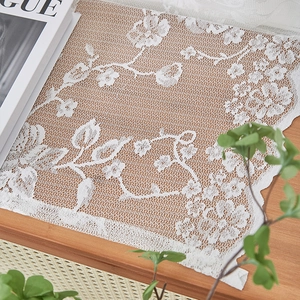 French style white floral lace curtain with rose pattern on a warm wooden background