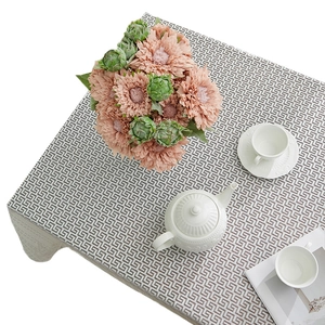 Elegant white lace tablecloth with geometric patterns for a cozy home dining decor