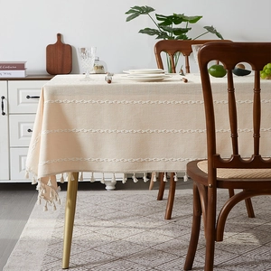 Beige linen cotton tablecloth with white wavy embroidery and elegant tassel fringes