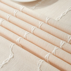 Minimalist cotton linen tablecloth with white woven texture and soft beige fabric