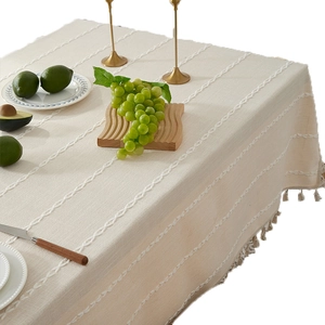 Modern cream cotton linen tablecloth with woven stripes and elegant fringe tassels