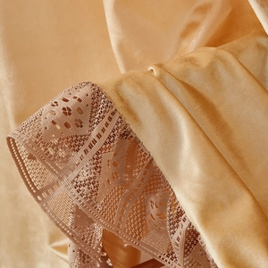 Detail of luxury champagne satin fabric with elegant floral lace embroidery and texture
