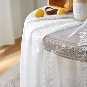 White French lace tablecloth with floral embroidery and ruffled edge for round tables
