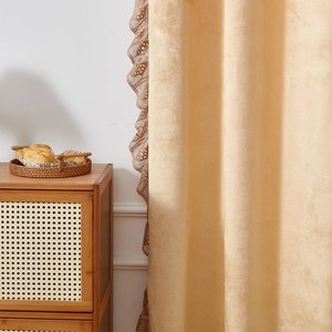 Close-up of beige velvet curtain with brown lace trim detailing for bedroom
