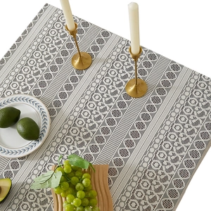 Bohemian white lace tablecloth with geometric hollow patterns on an elegant dining table