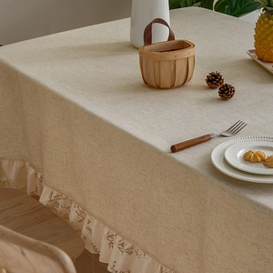 Rectangle beige linen tablecloth with white lace edges for a rustic dining table decor