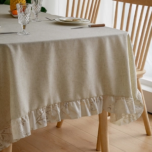Solid khaki linen rectangular tablecloth with ruffled edges and gold leaf patterns