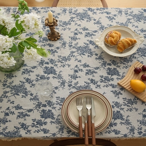 French country style blue floral cotton linen tablecloth with tassel edges on dining table
