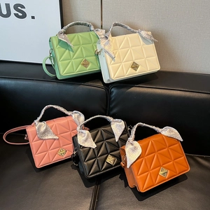 Quilted shoulder bags with lock closure and silk scarf handles in five colors