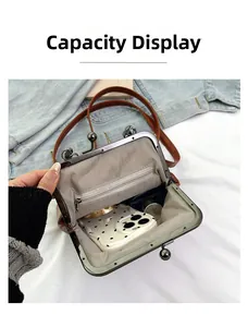 Internal view of vintage kiss-lock bag showing capacity for phone and small items