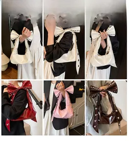 Detail of studded bow shoulder straps in multiple colors for retro tote bags