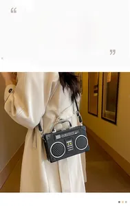 Creative boombox crossbody bag with retro radio design and silver metal handle details