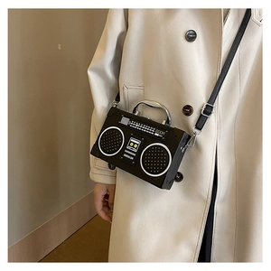 Detail of the vintage radio box bag with realistic speakers and boom graphics