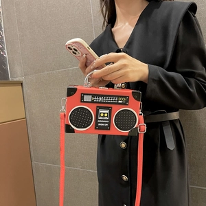 Retro red radio-shaped crossbody bag with silver handle and boom design elements