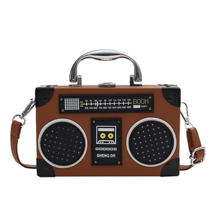 Retro radio shaped crossbody bag in brown leather with metal handle and dial design