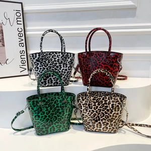 Leopard print bucket tote bags in four colors with adjustable shoulder straps and top handles