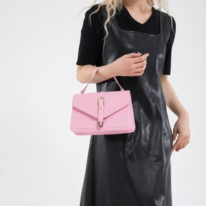 Pink retro crossbody small square bag with golden buckle shown on a model