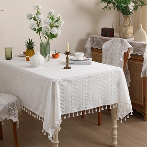 White hollow lace tablecloth with flower patterns and tassels for dining room decor