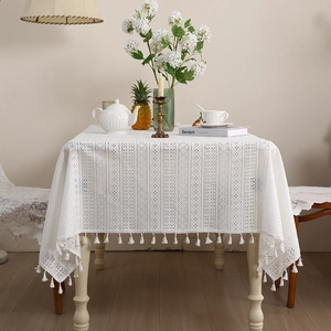 White hollow lace rectangular tablecloth with tassel edges and rustic floral patterns