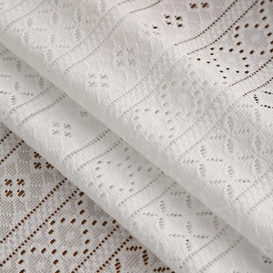 Elegant white lace tablecloth with hollow geometric floral embroidery and mesh texture