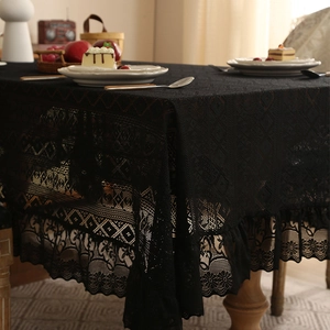 Elegant black lace tablecloth with floral patterns and ruffled edges for home decor