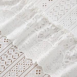 Nordic luxury white lace tablecloth with intricate floral hollow embroidery and ruffled edges