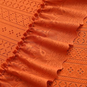 Nordic orange lace tablecloth featuring floral hollow textures and ruffle edge design