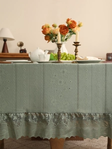 Sage green tablecloth with intricate lace border and retro hollow-out floral details