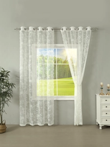 Detail of white lace sheer curtains with floral embroidery and metal grommet top design
