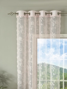 Detail of light pink lace curtain featuring elegant rose embroidery and silver grommets