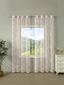 Detail of pink lace sheer curtains with floral embroidery and metal eyelet rings