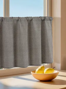 Detail of black and white checkered cotton linen cafe curtain with pleated top design