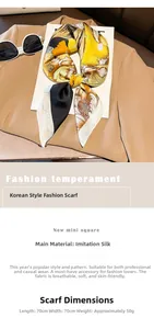 Detailed view of a 70x70cm yellow floral satin scarf with close-up fabric texture