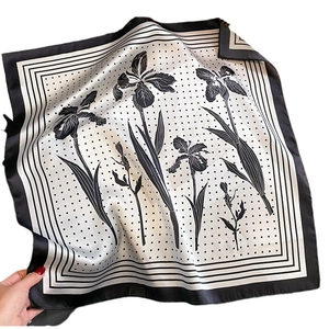 Elegant silk scarf with classic black and white iris floral print and polka dot pattern