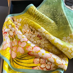Floral print square silk scarf in yellow and green with elegant hand-rolled edges