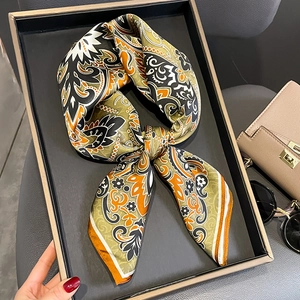 Silk neck scarf featuring retro paisley floral patterns in olive green and warm orange tones