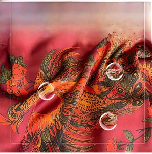 Detailed close-up of premium silk scarf fabric featuring vibrant phoenix and floral prints