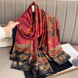 Silk-textured long scarf featuring red and black peacock feather and floral patterns