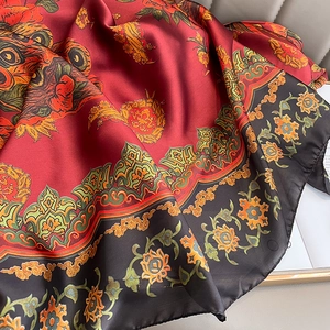 Vintage red and black floral silk scarf with traditional pattern in soft draped folds