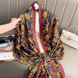 Elegant navy blue paisley print silk scarf shawl for women with orange accents and retro pattern