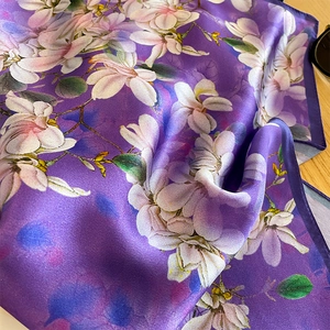Elegant mulberry silk scarf featuring violet floral prints and premium satin finish
