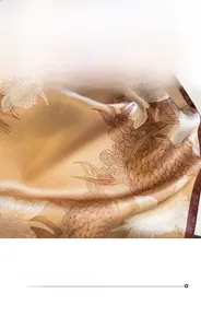 Detailed view of champagne silk scarf featuring fine stitching and elegant floral patterns