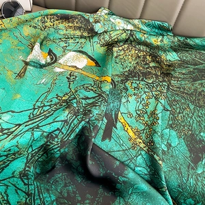 Luxurious faux silk scarf with green nature bird print and smooth glossy finish
