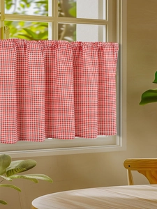 Detail of red and white checkered cafe curtain with rod pocket and pleated header