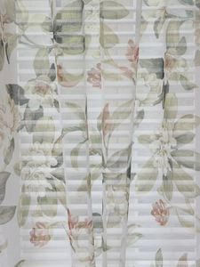 Close-up of rustic floral sheer curtain showing light-filtering crochet fabric detail